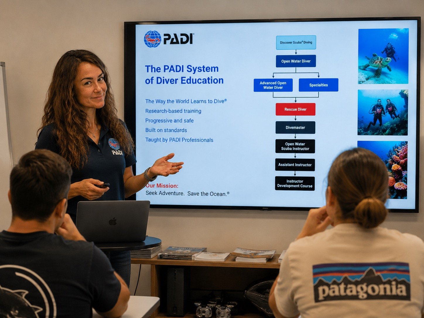 Deniz Akçalı presenting PADI System of Diver Education in classroom